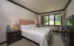 Jr. Master suite with king bed and en-suite bathroom.